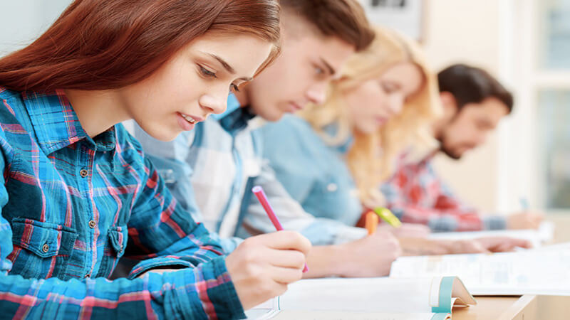 Students writing in class